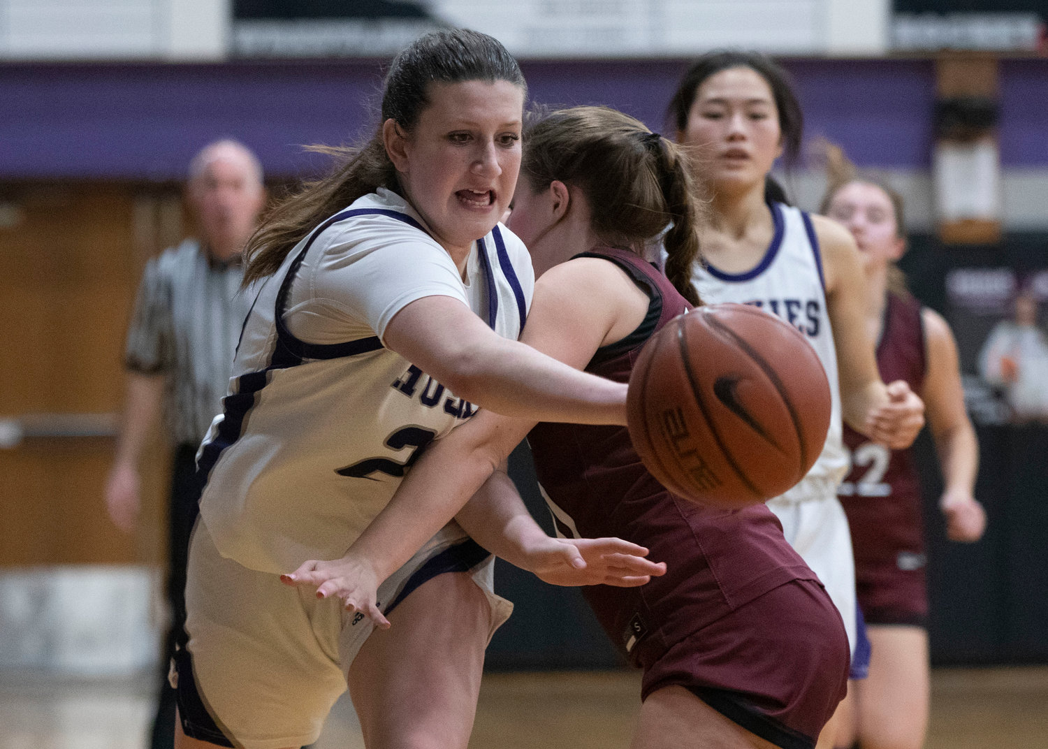 Emily Moran attempts to dribble by a Prout defender. The Huskies beat Prout 45-34 in a Division II game on Tuesday night.