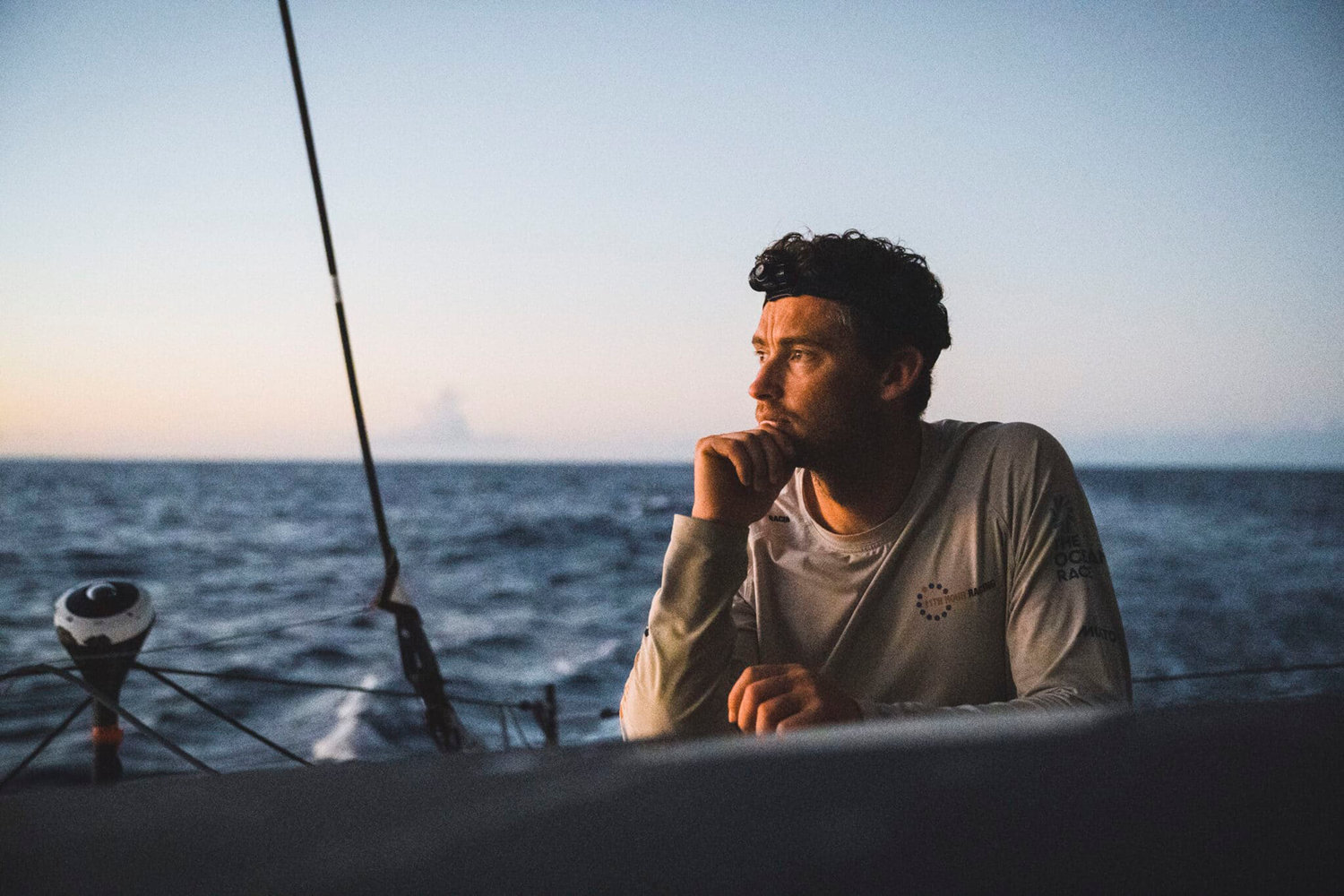 02 February 2023, Onboard 11th Hour Racing Team during Leg 2 from Sao Vicente, Cabo Verde, to Cape Town, South Africa...Jack Bouttell sticks his head out of the hatch for a moment of fresh air at the day’s end.