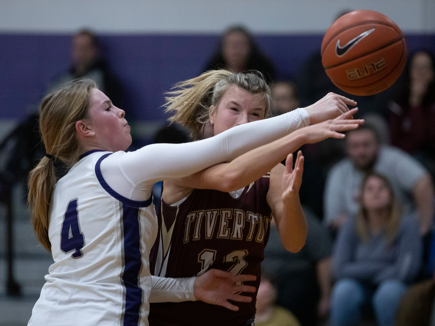 Lilly DaSilveira (left) knocks the ball away from Katie Richardson as she drives in for a layup.
