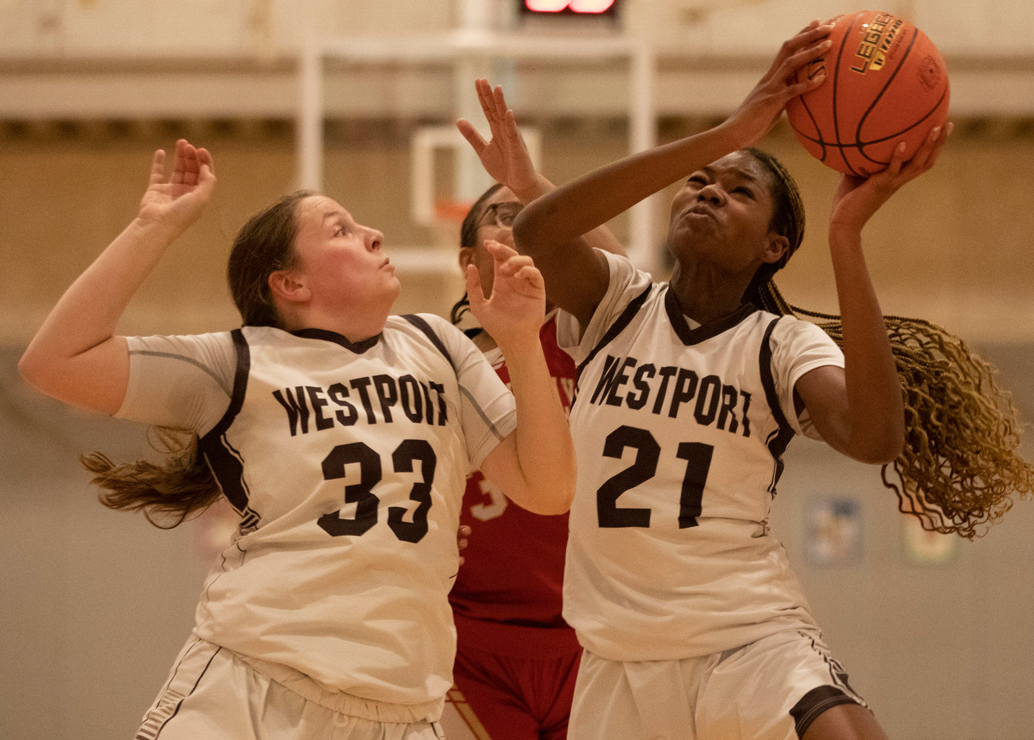 Sarah Perry (left) and Jenna Egbe bring down an offensive rebound.