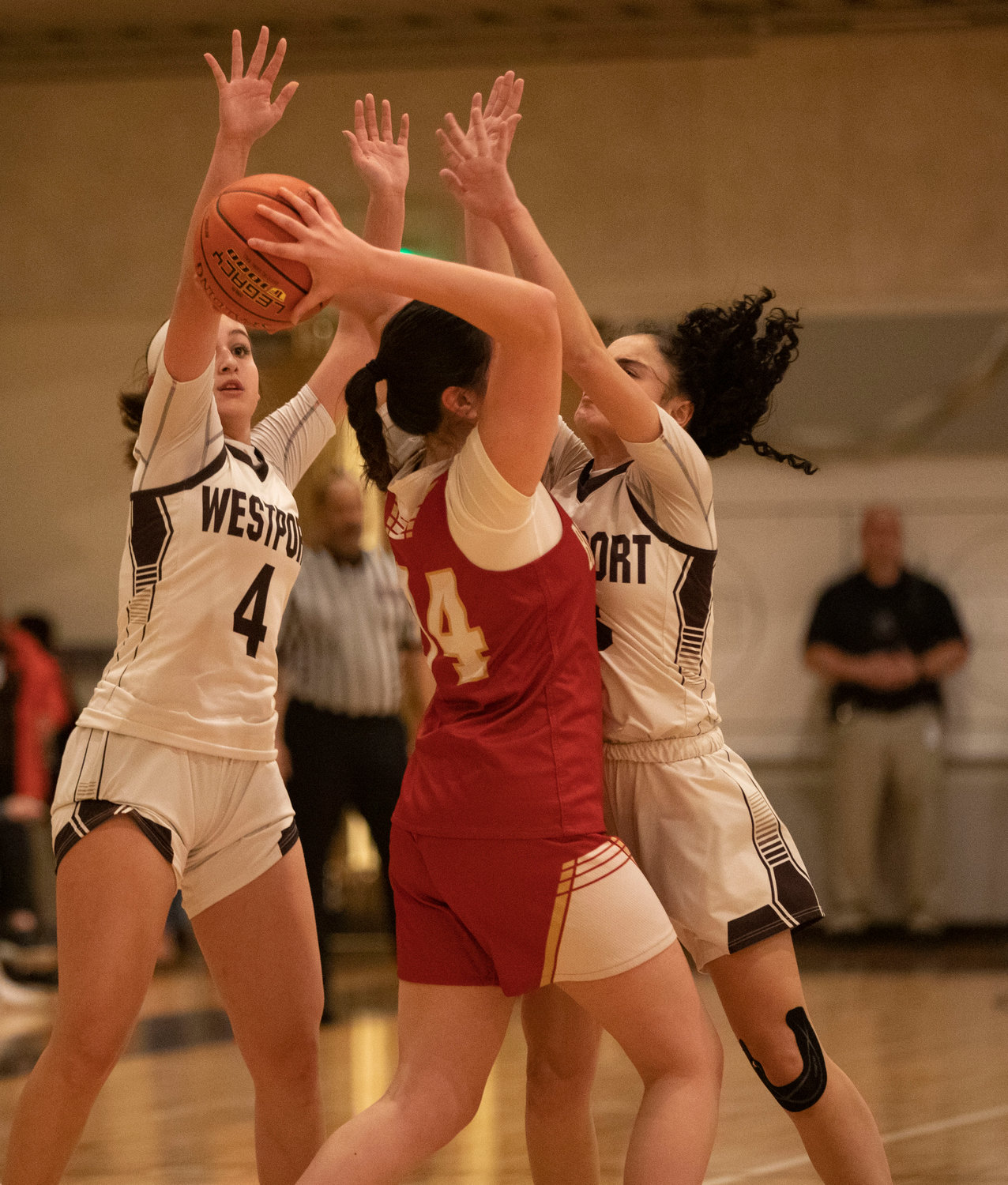 Leah Sylvain (left) and Korynne Holden double team a Cougars guard.