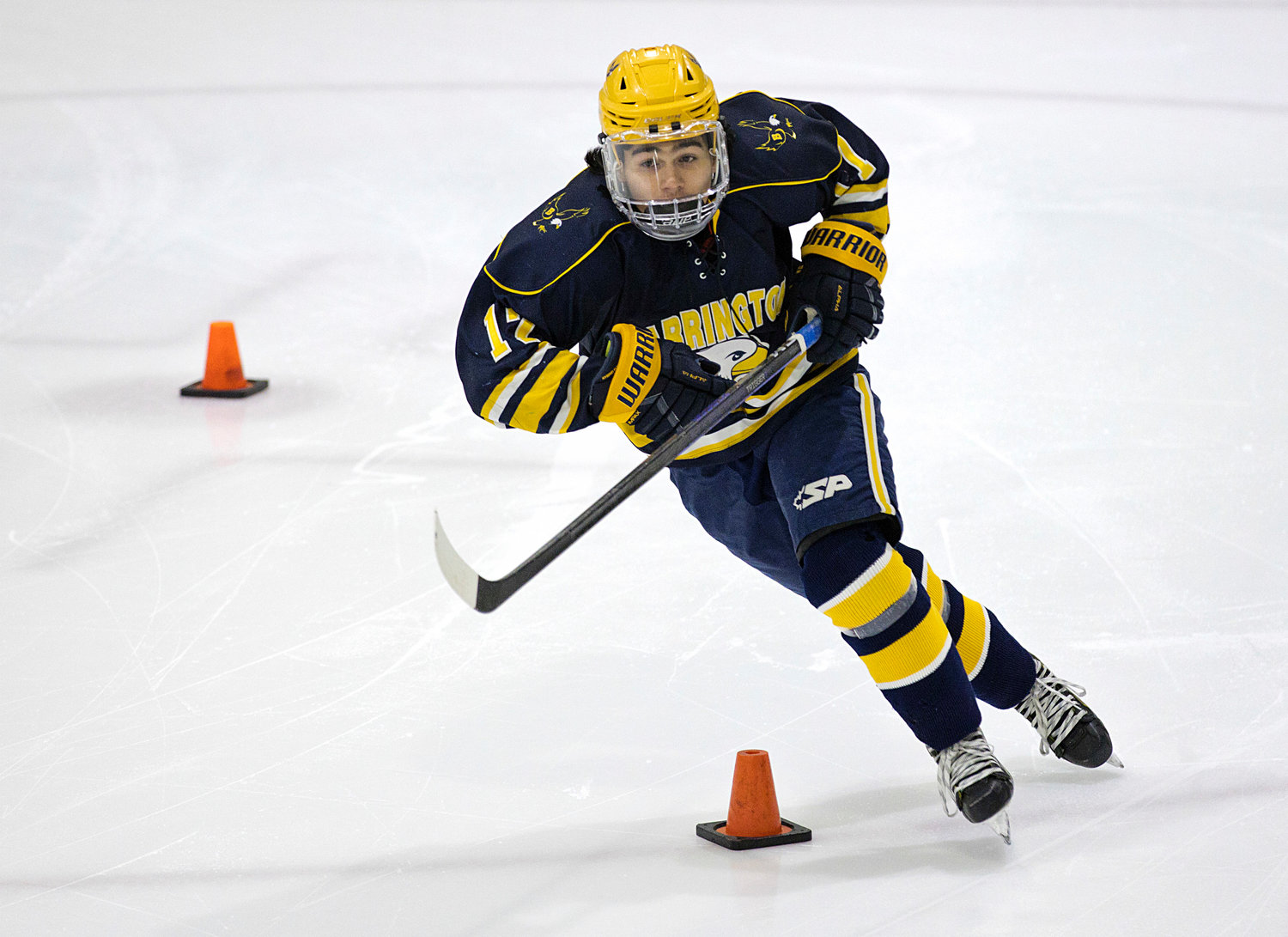 Drake Almeida speed skates around cones while competing for the fastest time during the first-ever J.P. Medeiros Jr. Hockey Competition with Mt. Hope High School, Saturday.