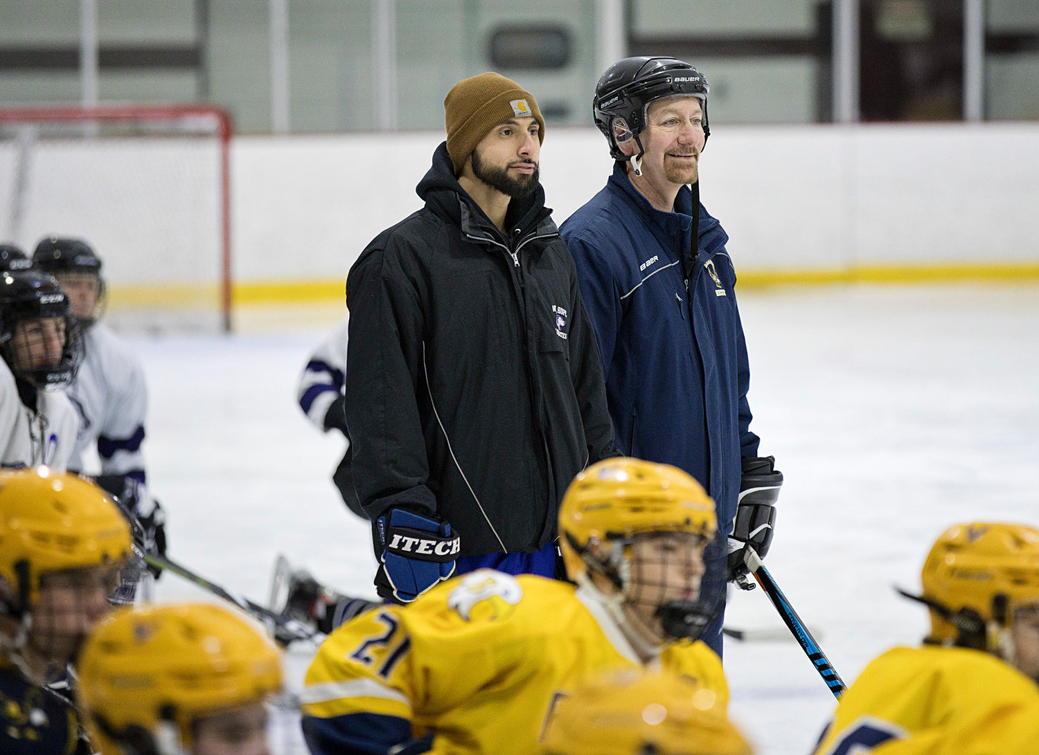 Mt. Hope coach, Joe DiBiase and Barrington's Tod Simalis oversee their players during a skills competition in honor of J.P. Medeiros.