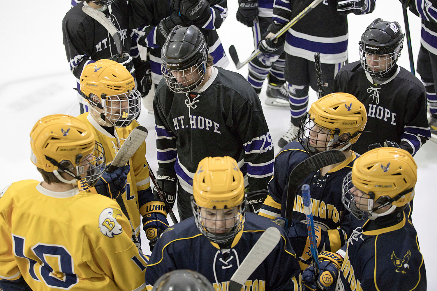 Mt. Hope and Barrington hockey players mingle during the first-ever J.P. Medeiros Jr. Hockey Competition, Saturday.