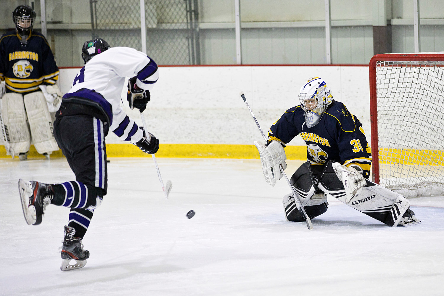 Oliver Browne fires a shot toward Barrington's Dominic Bruzzi while competing in a shootout.