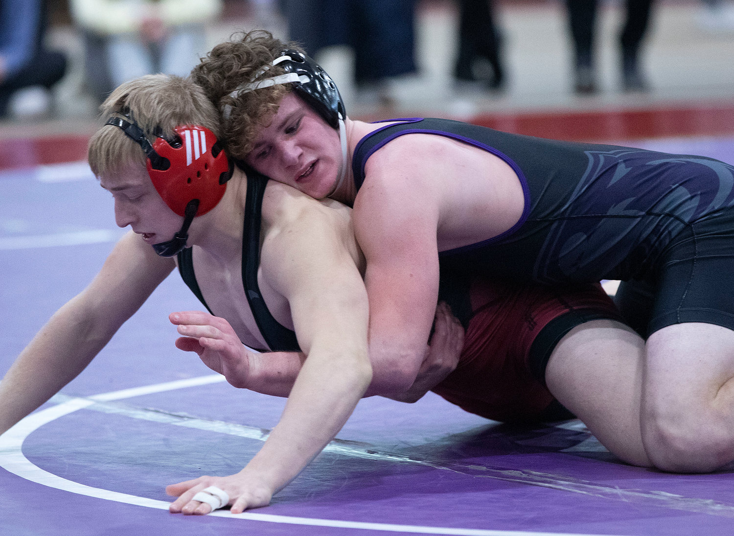 James Thibaudeau wrestles Ray McConnell of Narragansett during the consolation finals for fourth and fifth place.