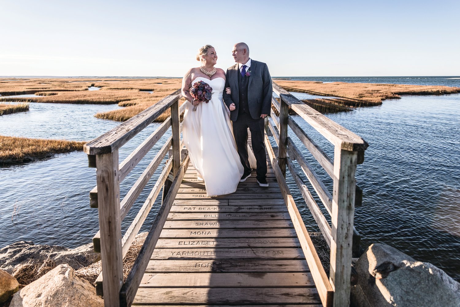 Rebecca and Nick Violette, both from Newport, held their wedding ceremony on the dock at Gray's Beach in Yarmouth, Mass., the site of their first date. 