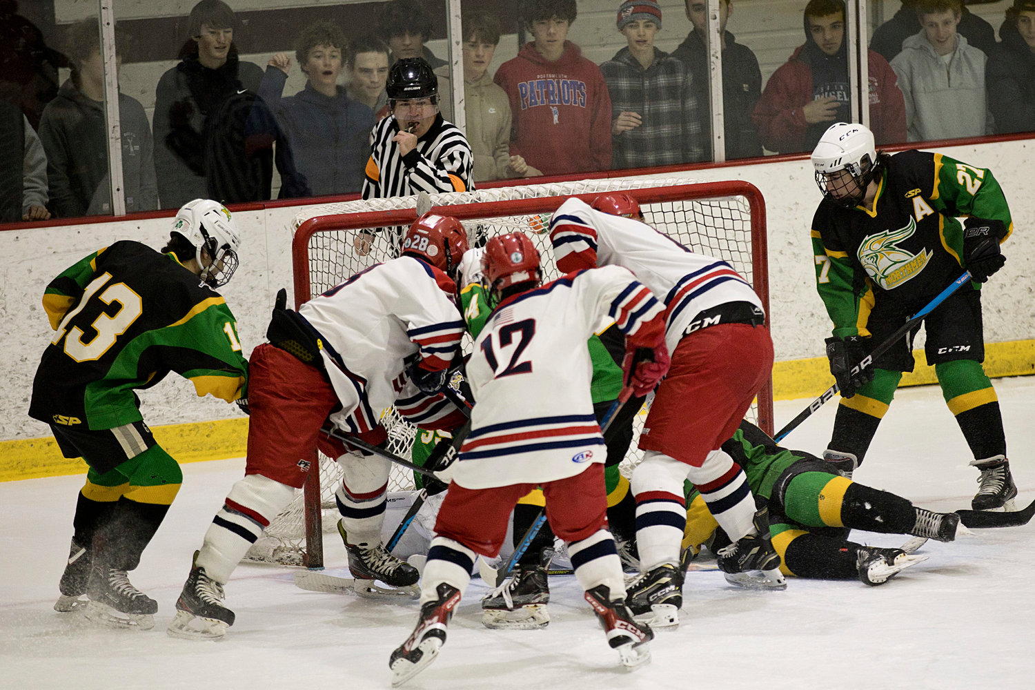 Patriots players create chaos in front of the Northmen’s net in an attempt to score.
