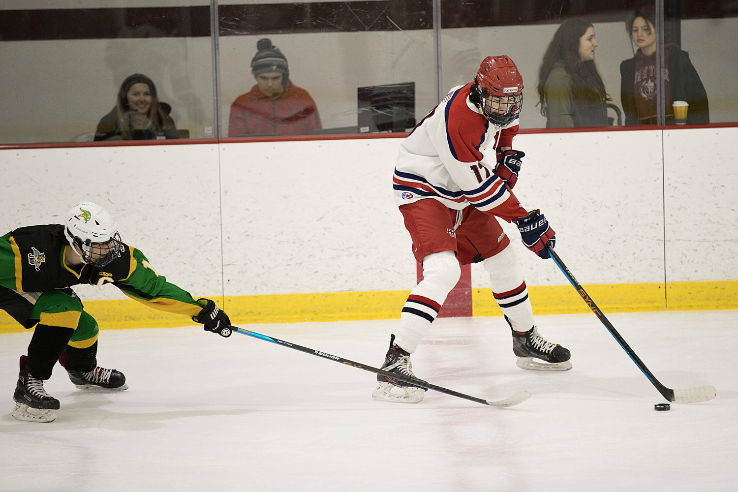 Dan Biello maneuvers the puck away from a North Smithfield defender.