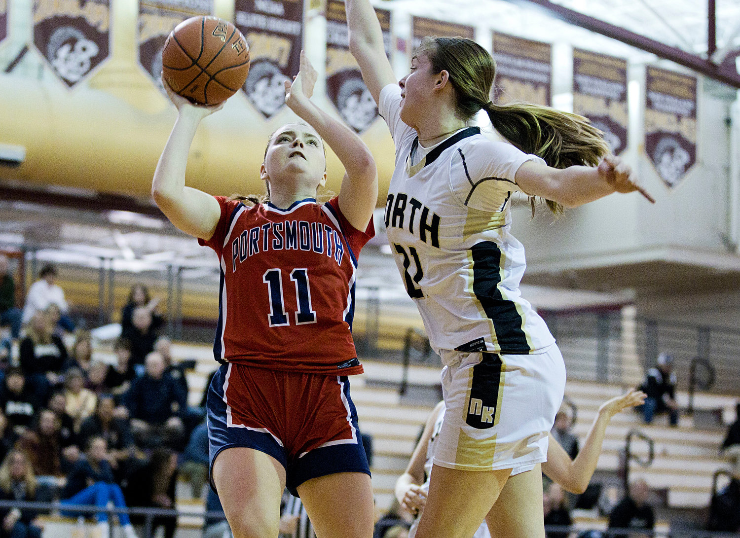 Maeve Tullson gets under the hoop to make a shot during the second half of Saturday’s game against North Kingstown.