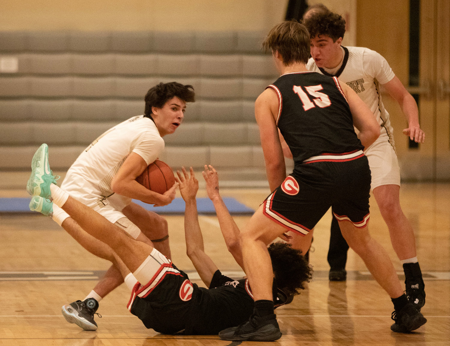 Owen Boudria makes rips the ball out of the hands of Greylock guard Noah Kane-Smalls as teammate Max Morotti looks on.