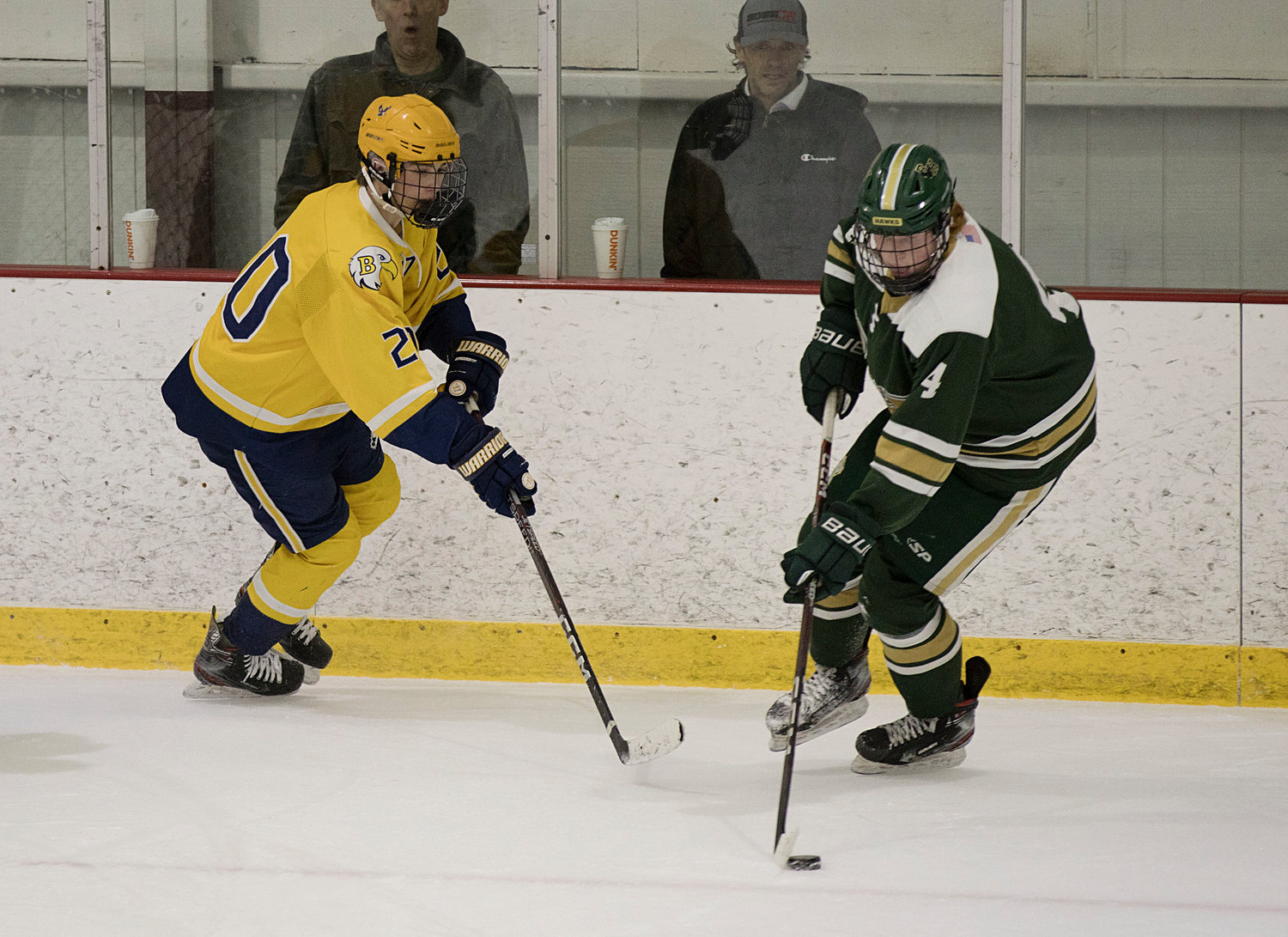 Henry Kelsey pressures a Hendricken opponent while competing in game two of the Division 1 quarterfinal series, Saturday.