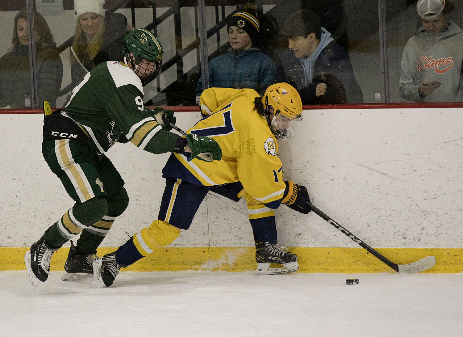 A Hendricken opponent pressures Drake Almeida from behind during game two of the Division 1 quarterfinals, Saturday.