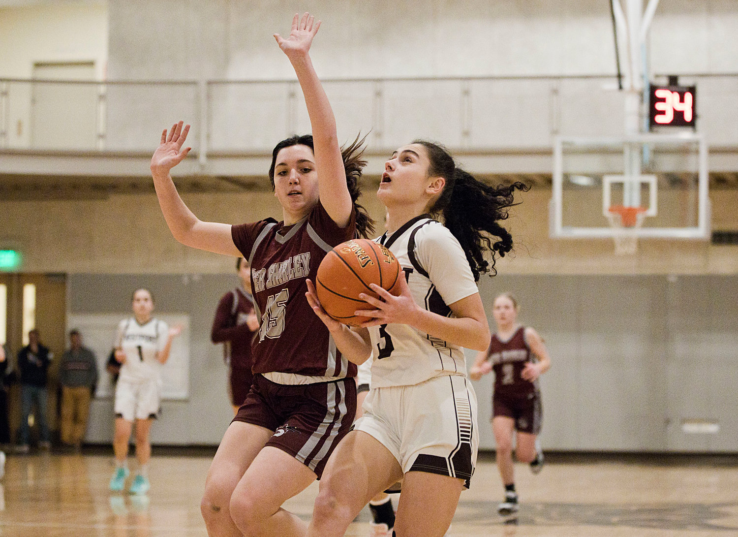 Korynne Holden drives to the hoop while battling Ayer Shirley, Tuesday. 