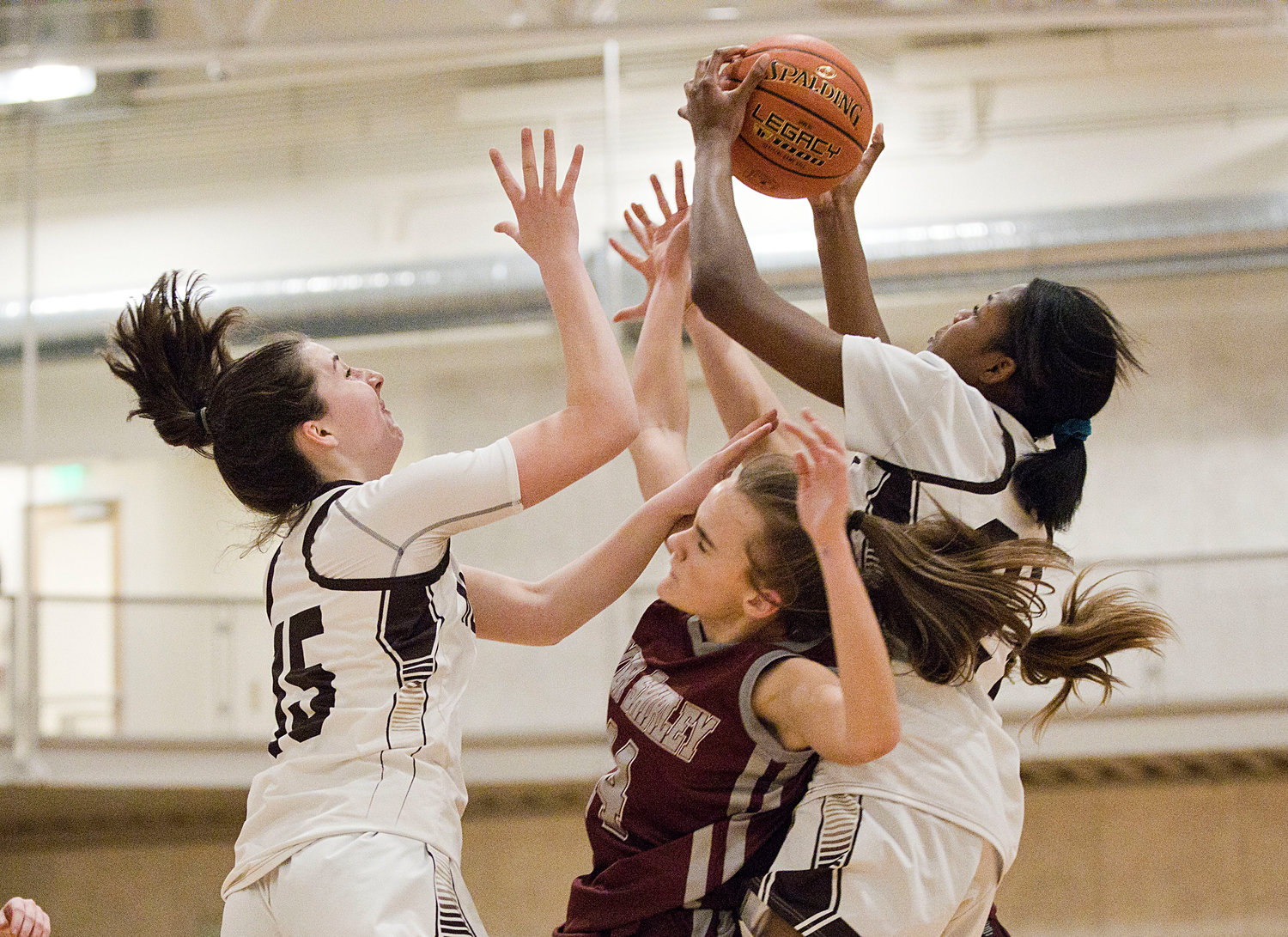 Meghan Molloy (left) and Jenna Egbe vie for the rebound. 