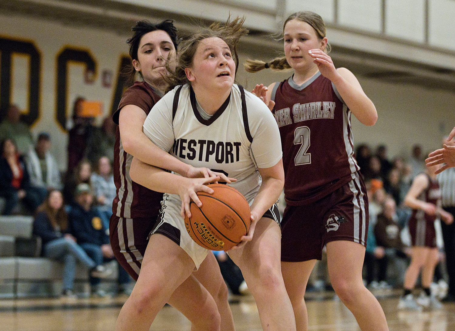 Sarah Perry is fouled while going in for a basket. 