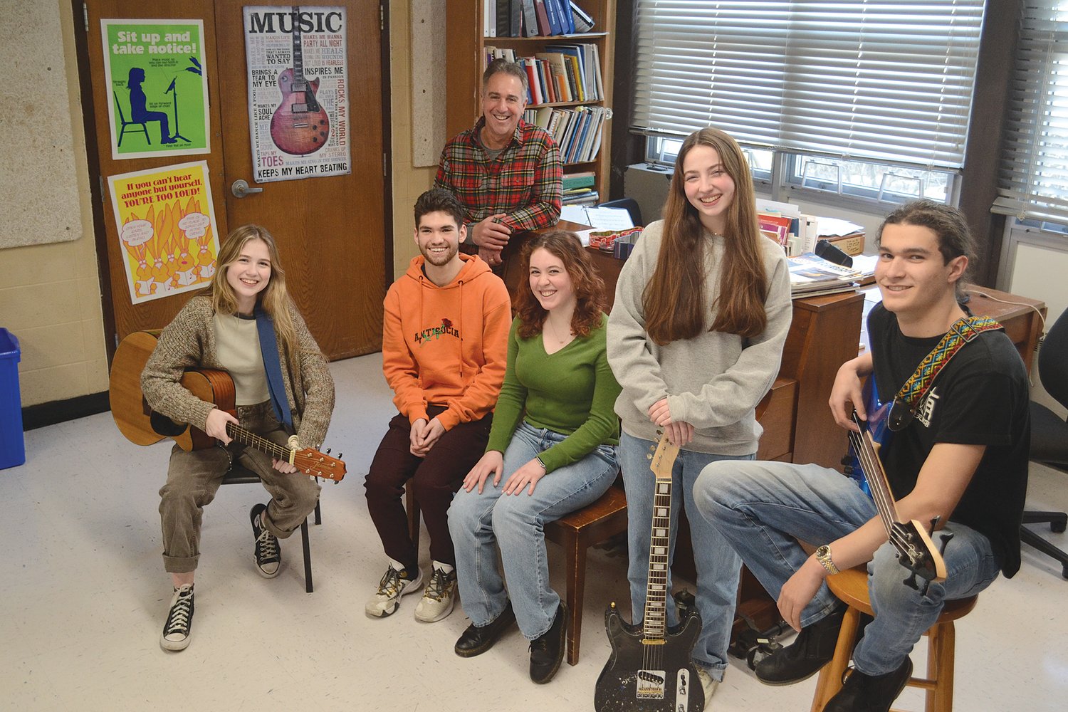Casey Ruth Little, Nathan Macedo, David Lauria (in back), Abby Bratsos, Millie Piper, and Joe Ricci pose inside the music room at Mt. Hope High School. The five students are leading members of the Tri-M musical honors society, which is in its first year at the school.