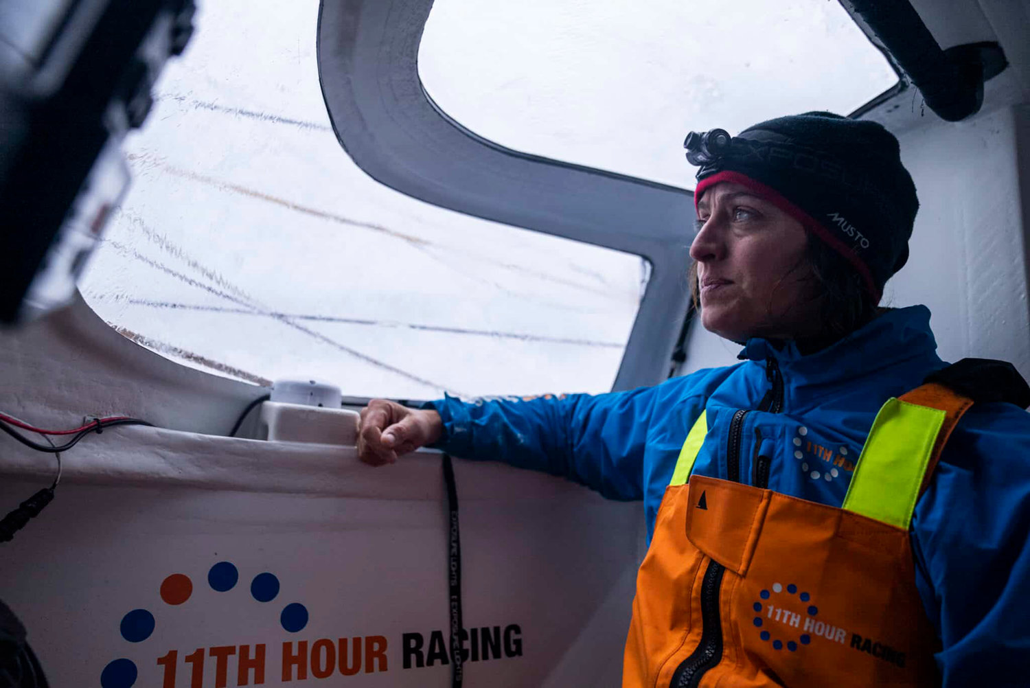The Ocean Race 2022-23 - 11 March 2023, Leg 3 onboard 11th Hour Racing Team. Justine Mettraux checking the trim of the front sails to leeward.