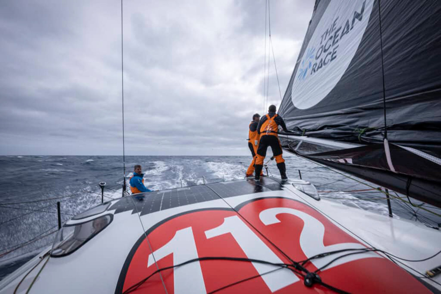 The Ocean Race 2022-23 - 05 March 2023, Leg 3 onboard 11th Hour Racing Team. Charlie Enright and Jack Bouttell clean up the reef ties as winds build, as Simon Fisher takes a look at the weather picture outside.