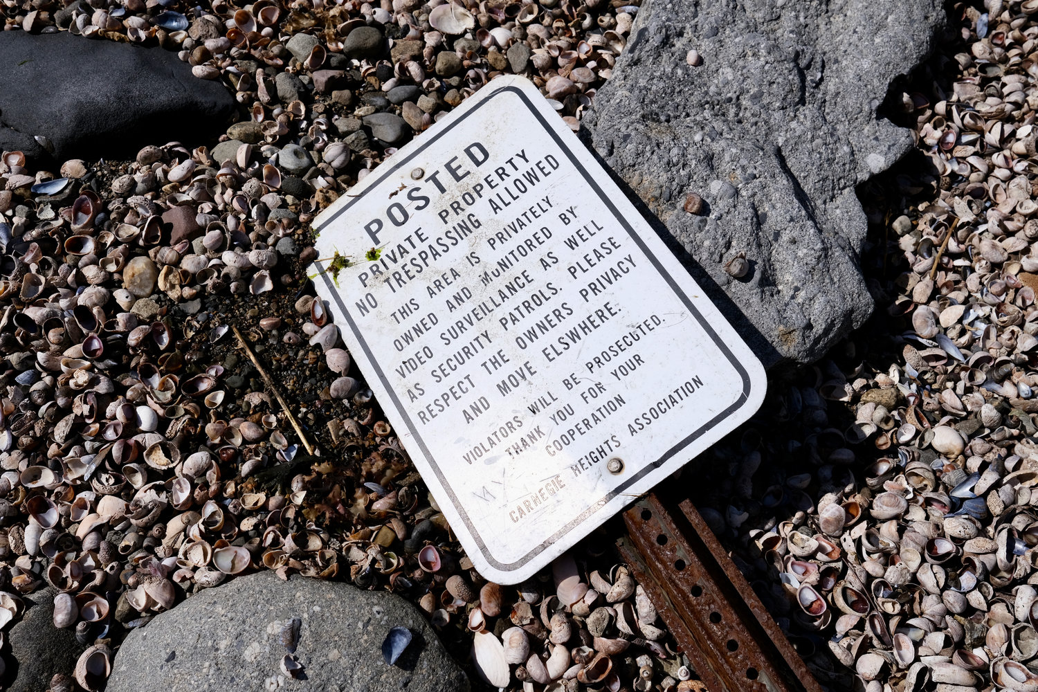 One of several downed signs found along the waterfront on the town’s west shore.