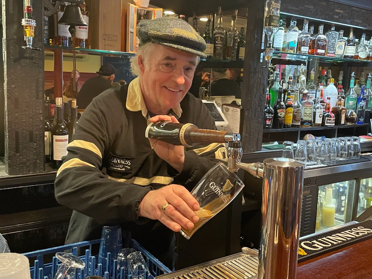 Eddie Woods pours a Guiness from behind the bar of  The Nest, his newly-opened Irish Pub, on the site of the former Bar 31 on State Street.