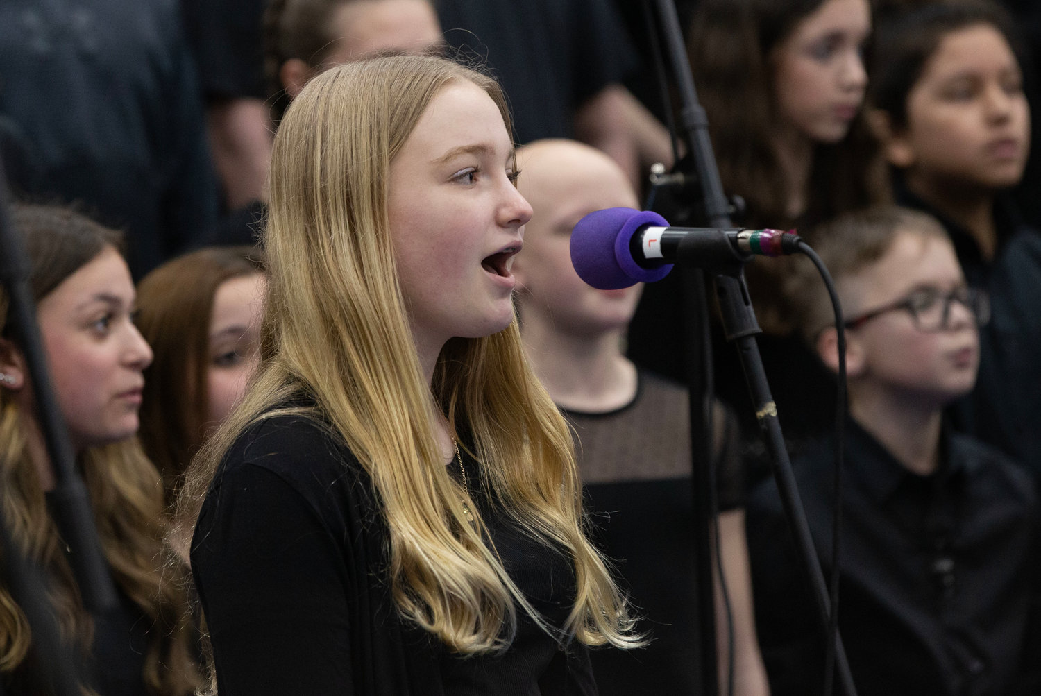 Charlotte Arsenault sings a solo during the song, Rise Up, with the Kickemuit Middle School Chorus.