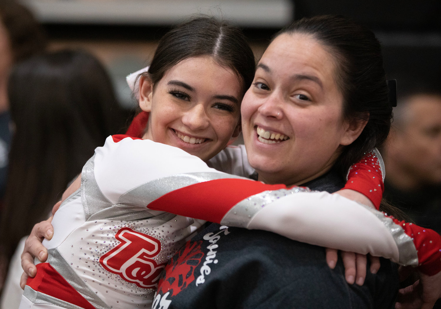 Mackenzie Pacheco receives a hug from mom Samantha Garelli after the Townies performance.