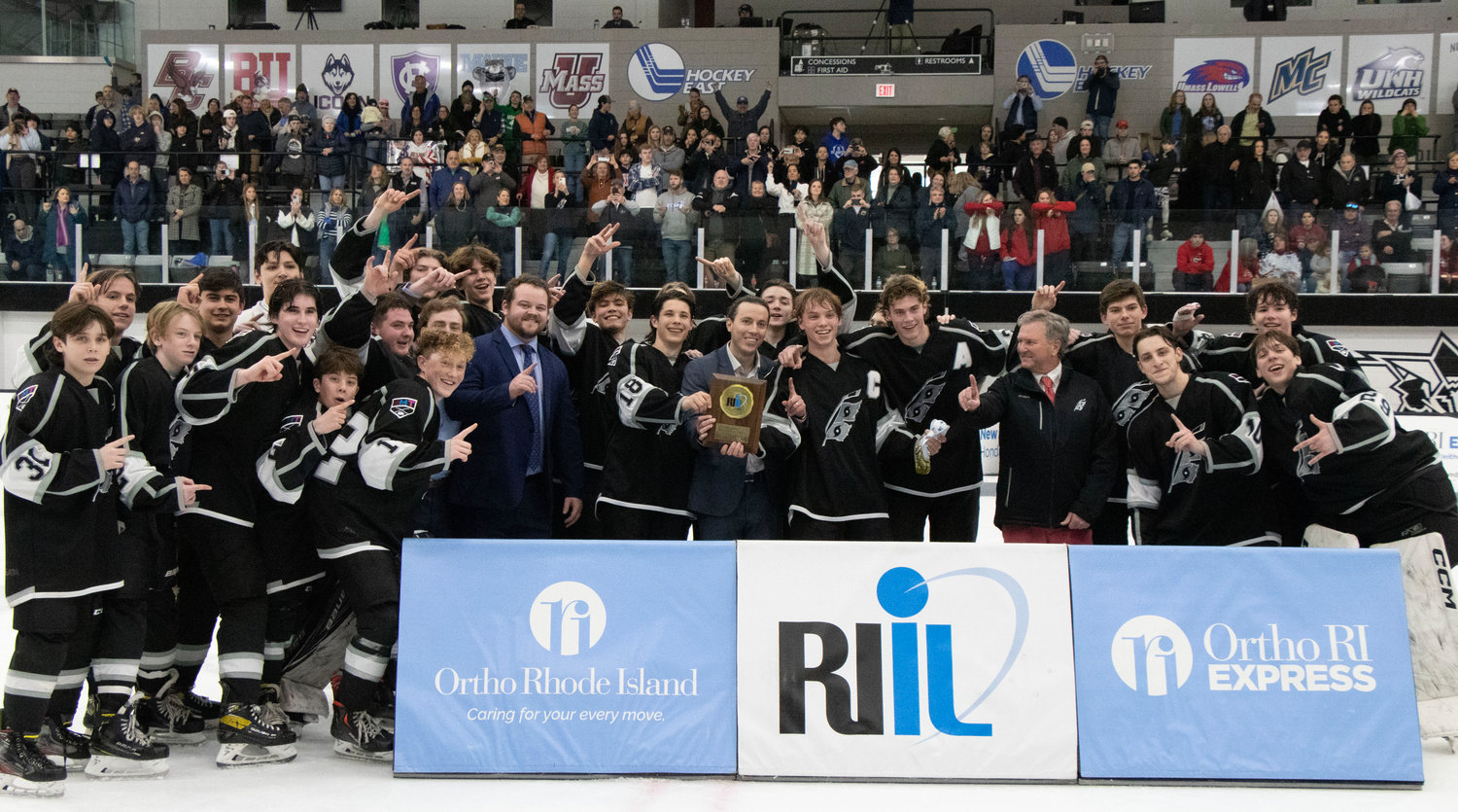 RMT team photo with the Division II Championship trophy.