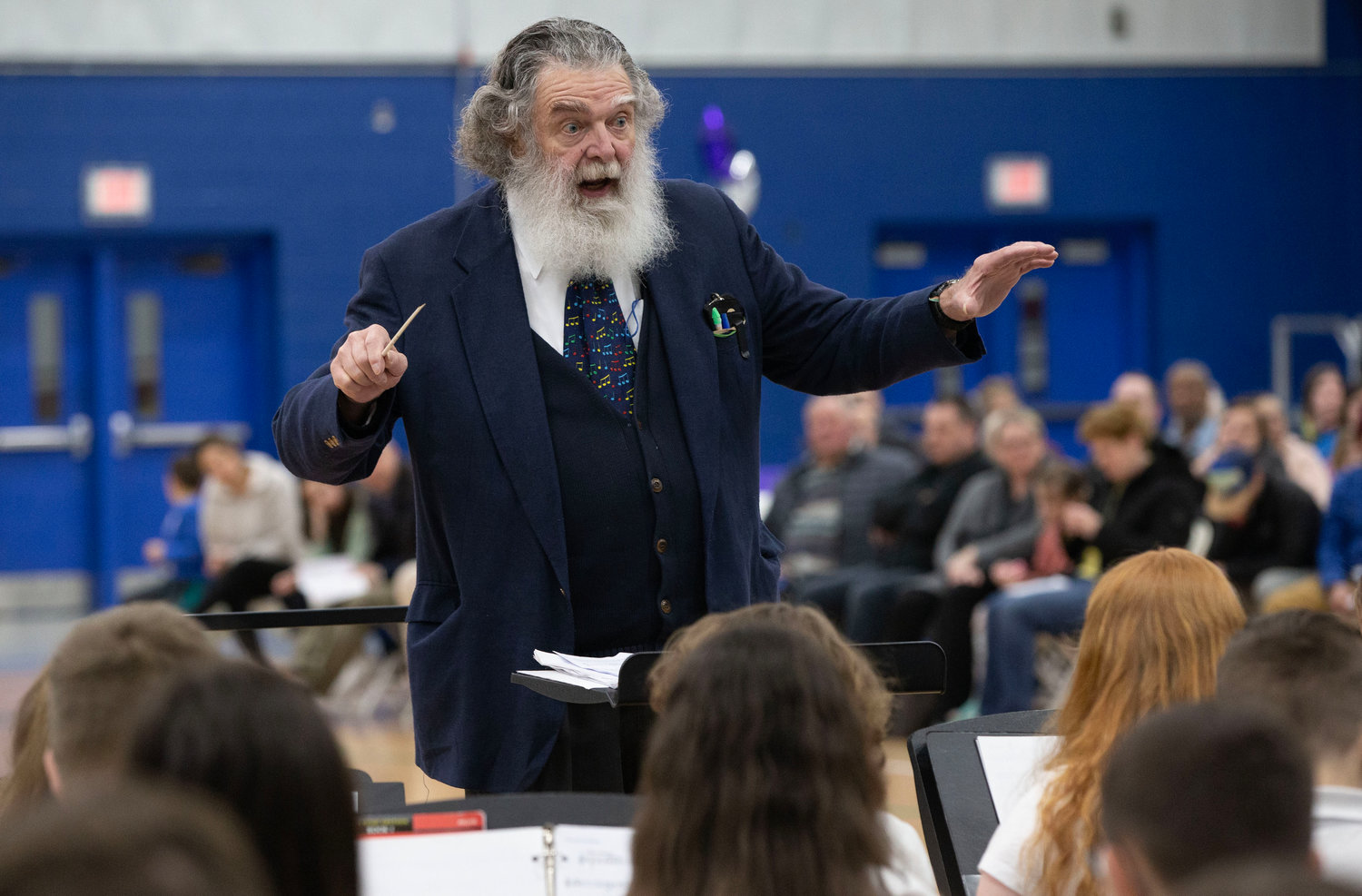 H. Bennett Burnham conducts a section of the Kickemuit Middle School band during the the combined band piece called Dr. Rock by Bruce Pearson.