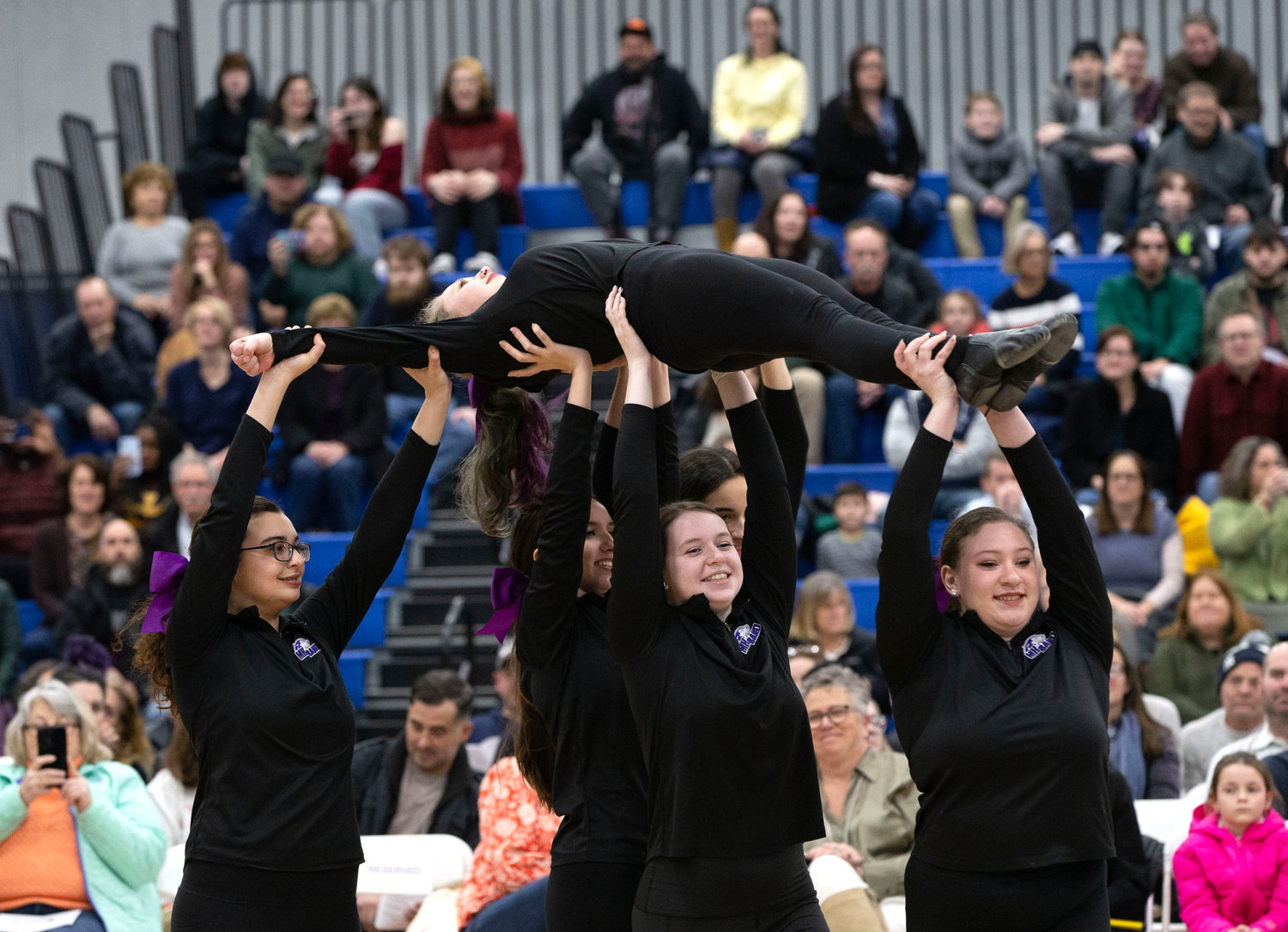 Delaney Clays (middle) and the dance team perform with the Mt. Hope Marching Band during I want to Hold Your Hand.