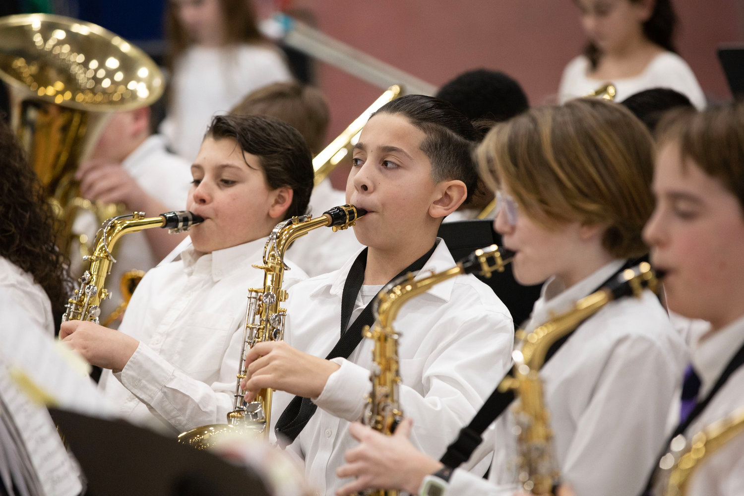Dario Coletta (left), Mason Melo-Simas, Aven Getchonis, Auden O'Shea and classmates perform with the Kickemuit Middle School Band during the Theme from “Symphony No 9.