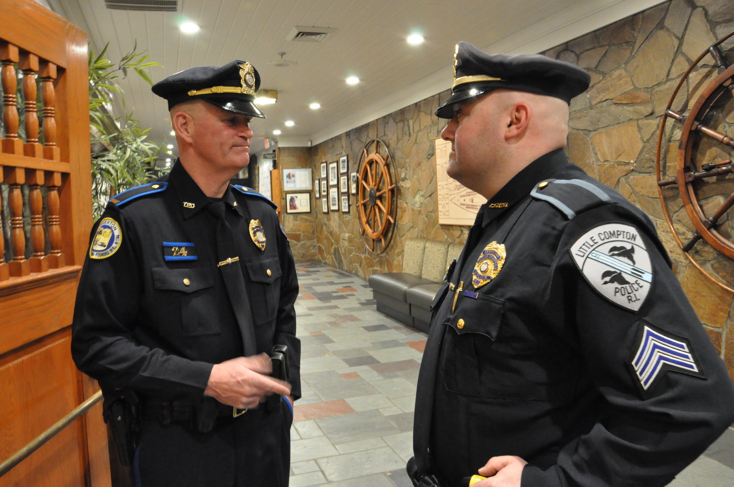 Tiverton Police Lt. Christopher Dyson (left) talks with Little Compton Police Sgt. Ryan LeClaire prior to the awards ceremony.