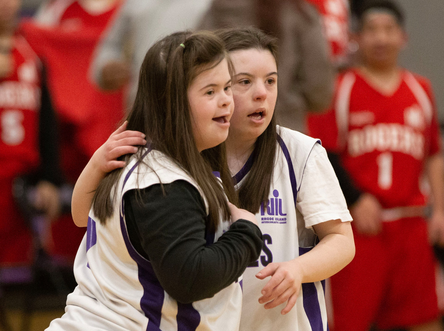Claudia Rezendes (left) and Paige Gauthier hug after the game.