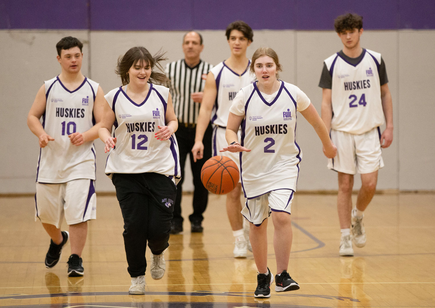 Mason Conte, Maci Catalano, Jesse Wilson, Charlotte Mowery and Evan Garies head up to the offensive court during the Huskies' game against Rogers at the high school on Thursday.