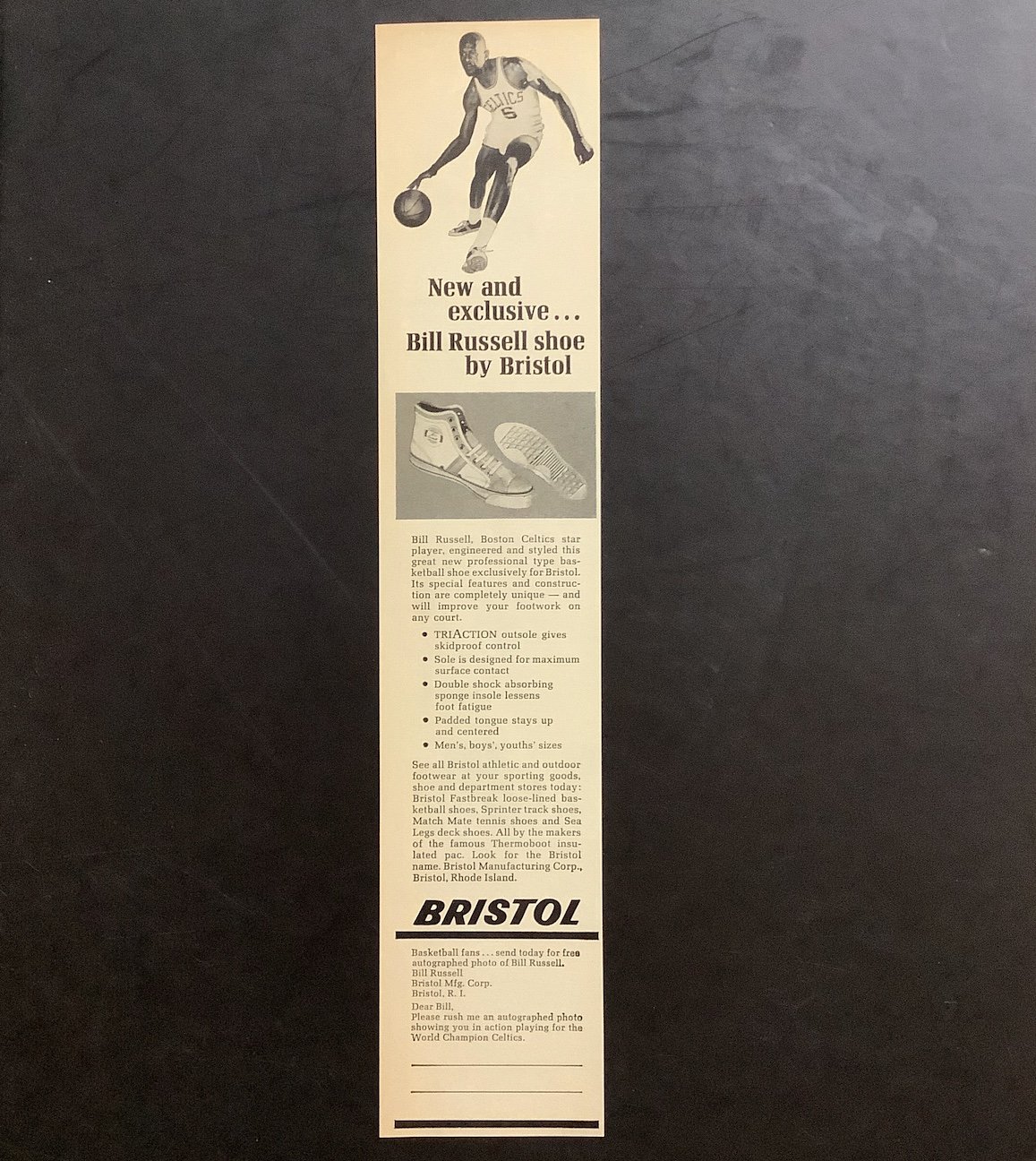 The photo with the autograph matches the photo from this advertisement that included an offer for a free photo and signature from Celtics legend Bill Russell.