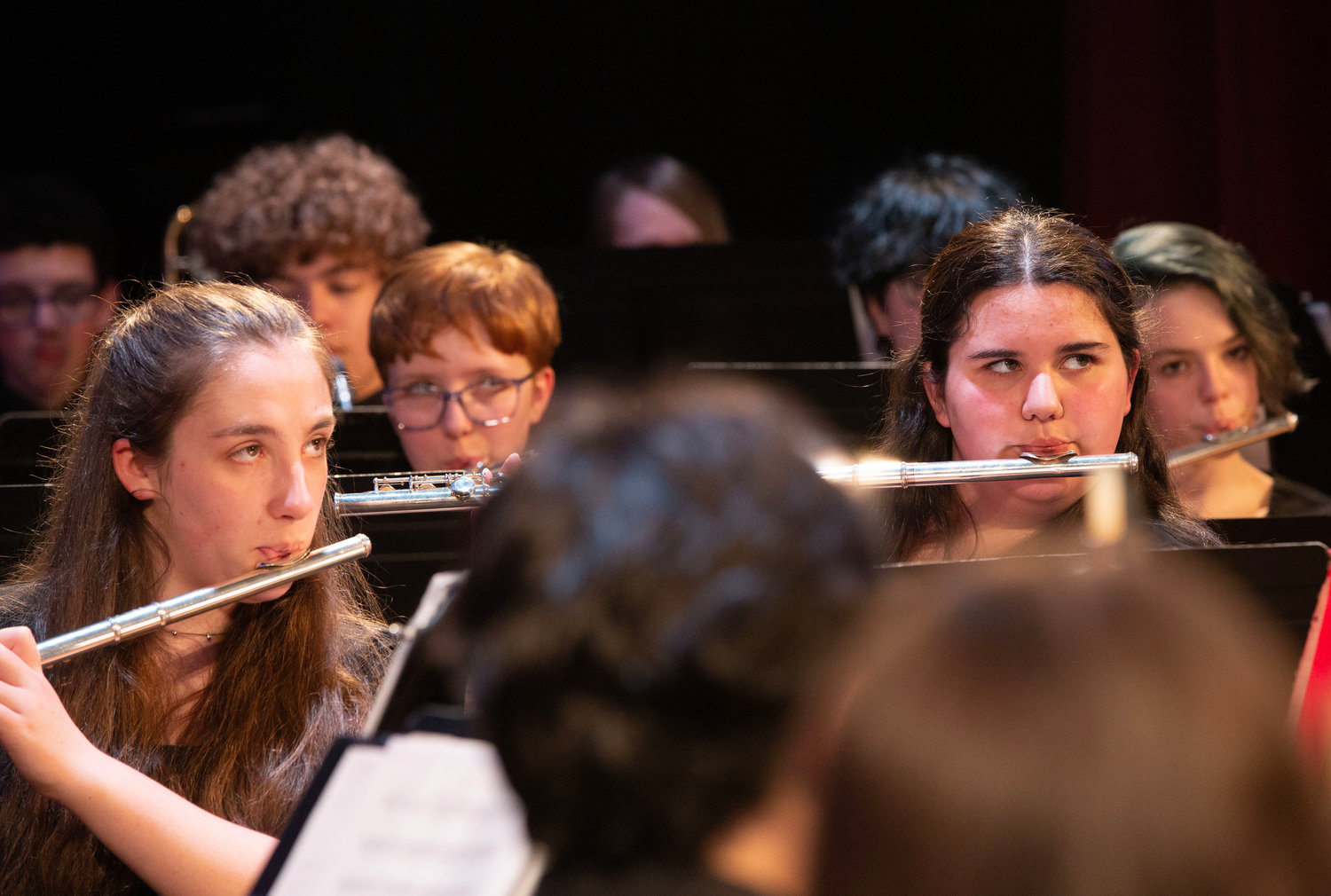 Madison McKinney (left) and Olivia Tobin and others play their flutes during “Heaven’s Light.”
