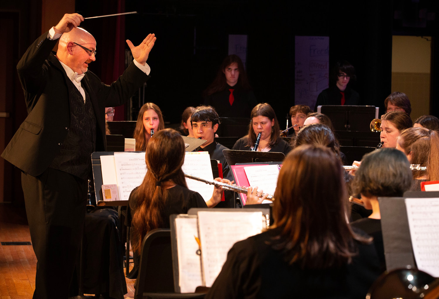 Symphonic wind ensemble director Ted Rausch leads the band on “Themes from Jurassic Park.”