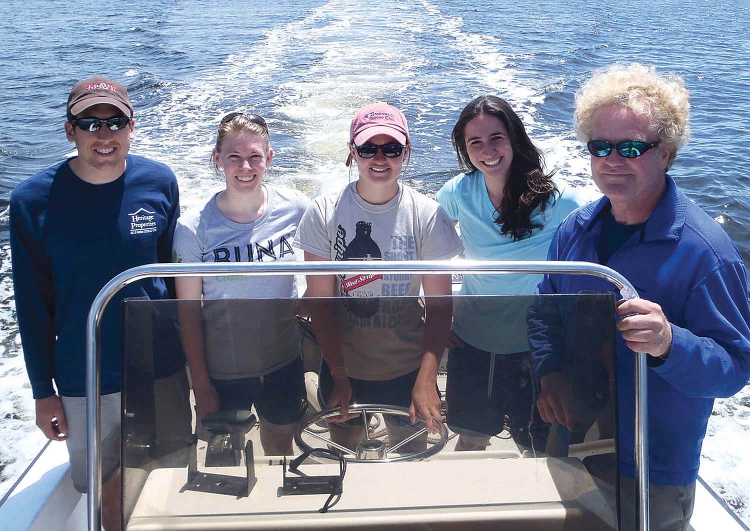 Mark Bertness (right), with a research team from Brown University, studying saltmarsh degradation in Narragansett Bay.