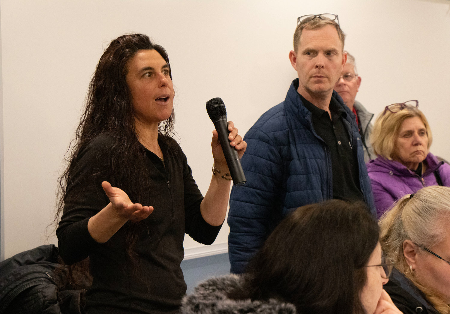 Sarah Godfrey asks a question about the community energy aggregation program in Barrington during a special meeting in March.