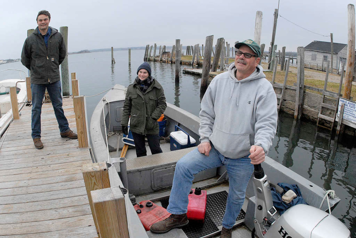 The late Gary Sherman (right) in 2015 with an unidentified deck hand at center and Chris Leonard, Westport's current shellfish constable and wharfinger, at left.