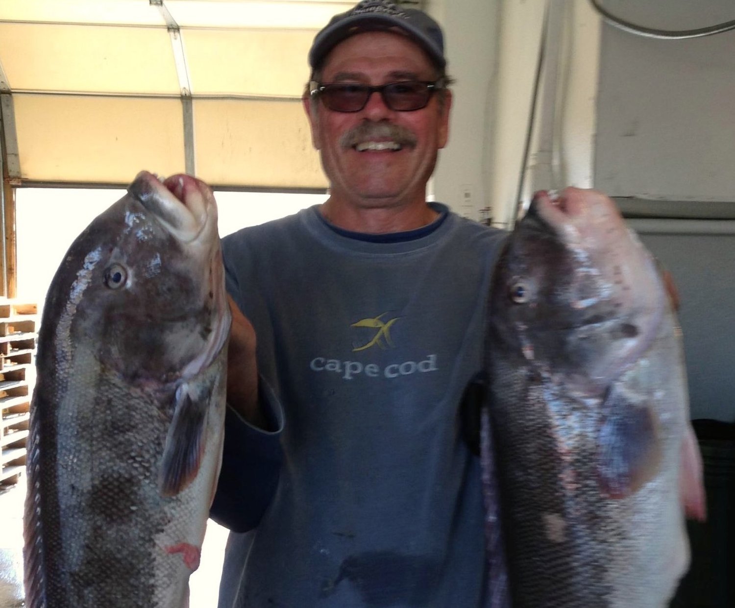 The late Gary Sherman with a nice pair of keeper tautog.