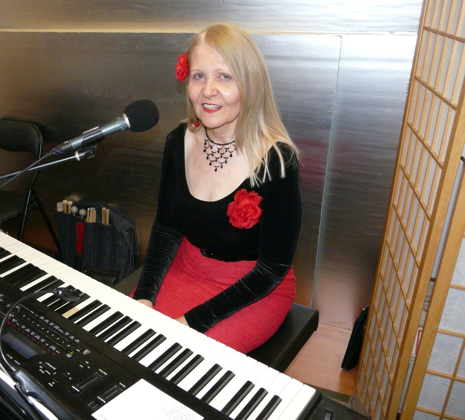 Kari Tieger, shown here on keyboard during a Valentine’s performance, began playing piano at age 14. She was given a new piano for her 15th birthday, and she still plays it today.