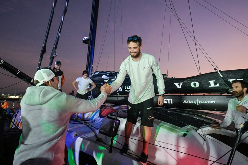 The Ocean Race 2022-23 - 5 April 2023. 11th Hour Racing Team finish Leg 3 at 08:20:23 UTC, 37 days, 20 hours, 10 minutes, 23 seconds, 14,840 nautical miles.  Jack Bouttel is welcomed by The Ocean Race Chairman Richard Brisius.