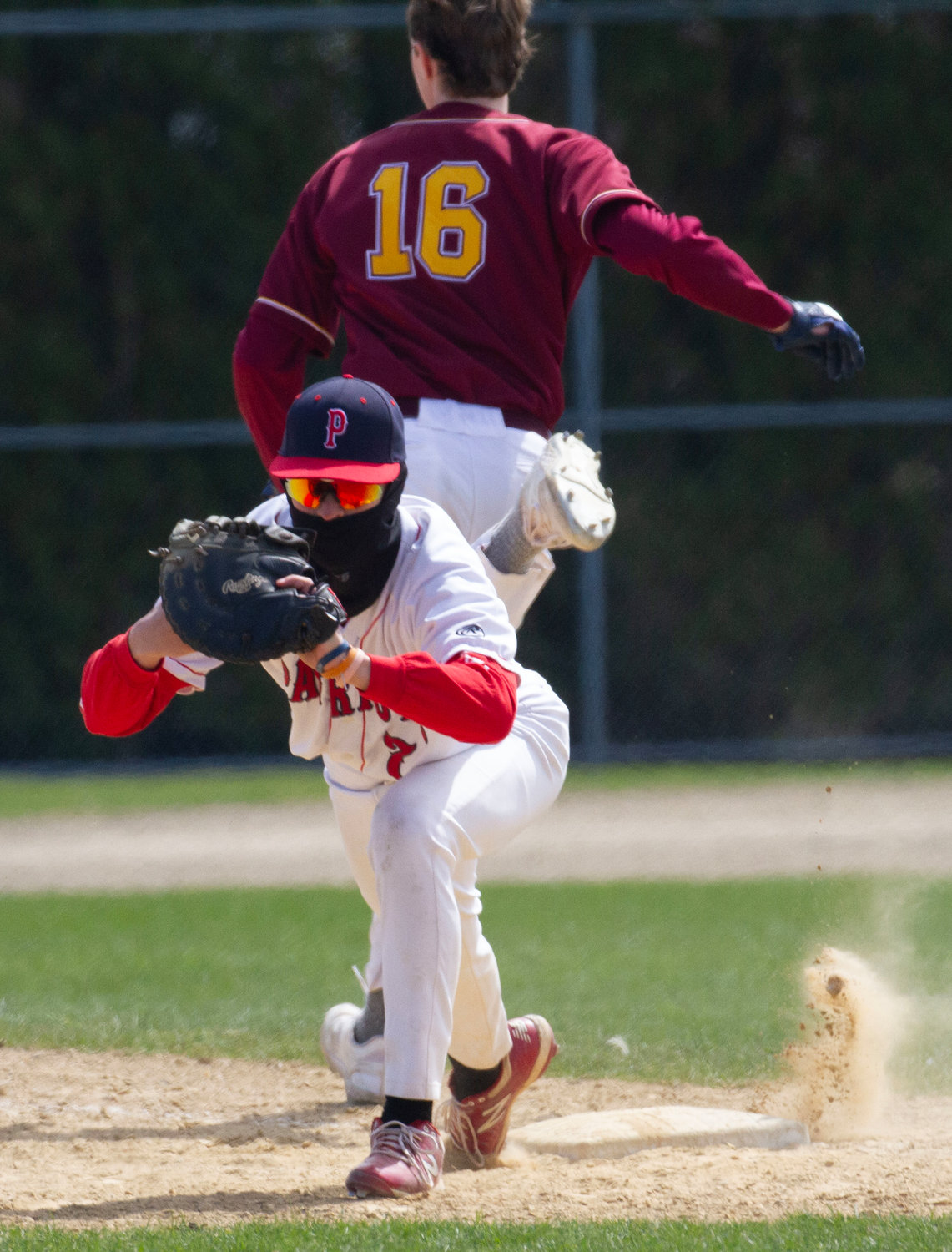 First baseman Cam Ruggieri makes a catch at first base for an out against Tiverton.