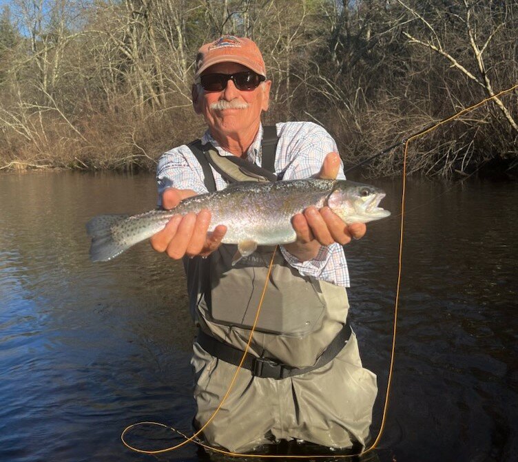 Big rainbow trout caught with fly rod by Dr. Nick Califano of Barrington at the Wood River, fishing with fly guide and friend Ed Lombardo.