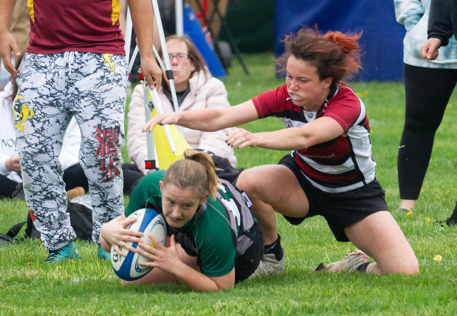 UVM fly half Emma Griffith dives for the goal line.