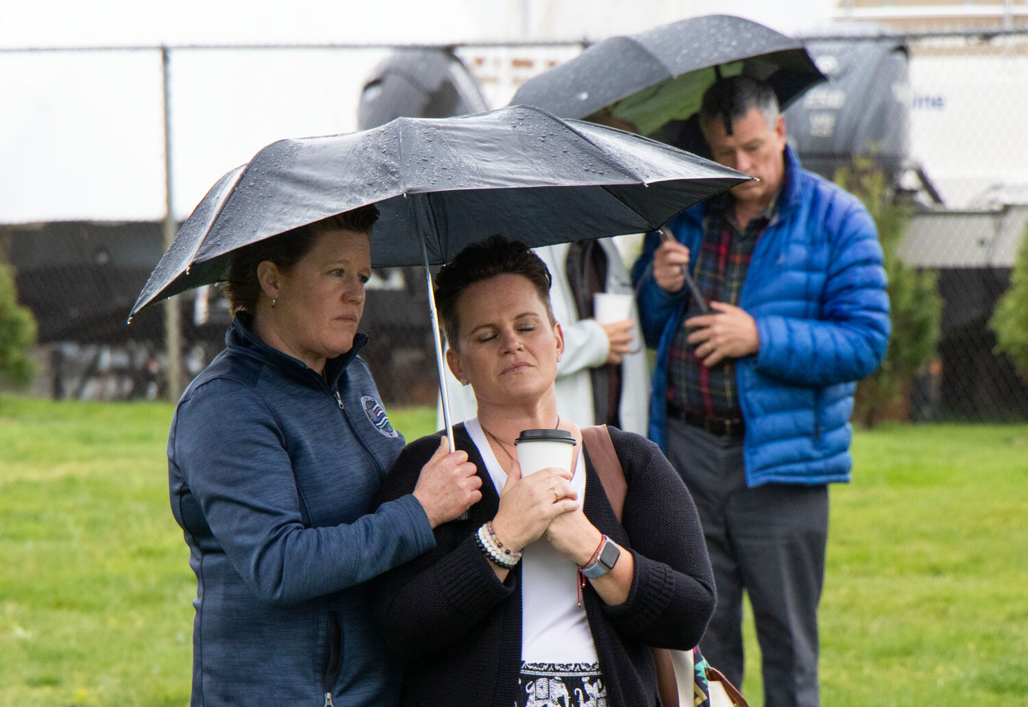 Maari Stainer (left) and Christine Beltrami listen on during the vigil.
