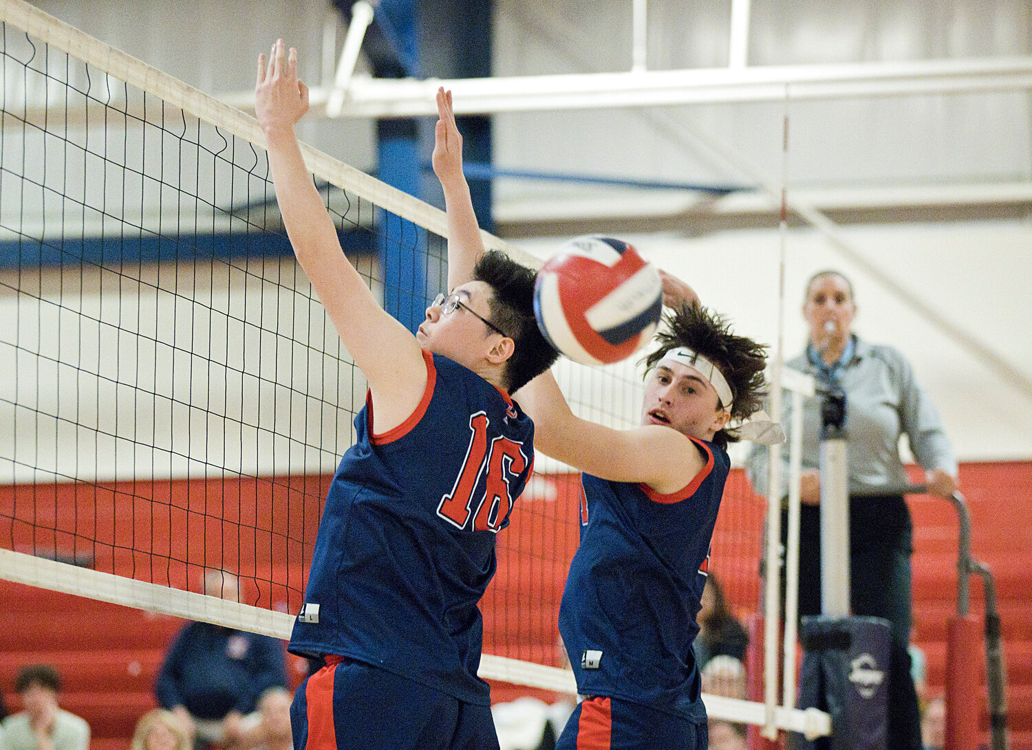Leekey Zhang (left) and Jackson Mello look for backup as the ball comes over the net.