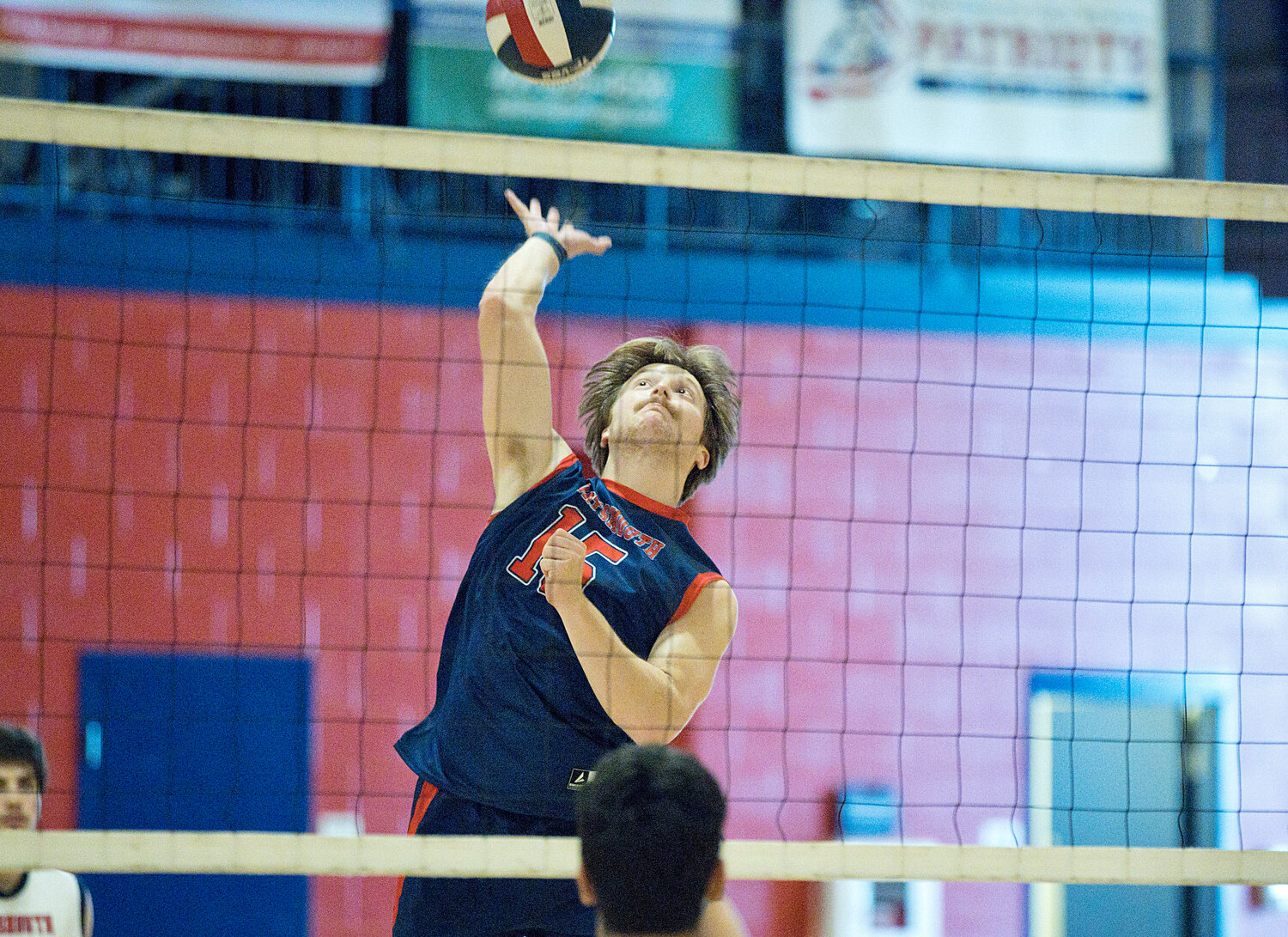 Portsmouth High’s Nick Waycuilis fires a spike to St. Raphael Academy’s side during the Patriots’ home win Tuesday night.