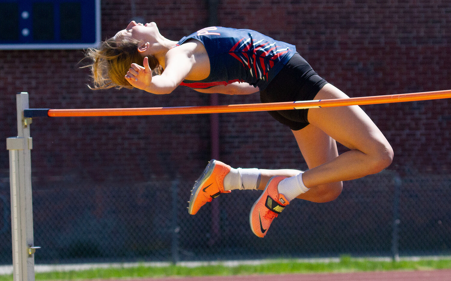The Patriots’ Morgan Casey soars over the bar en route to winning the girl’s high jump with a leap of 5 feet, 3 inches.